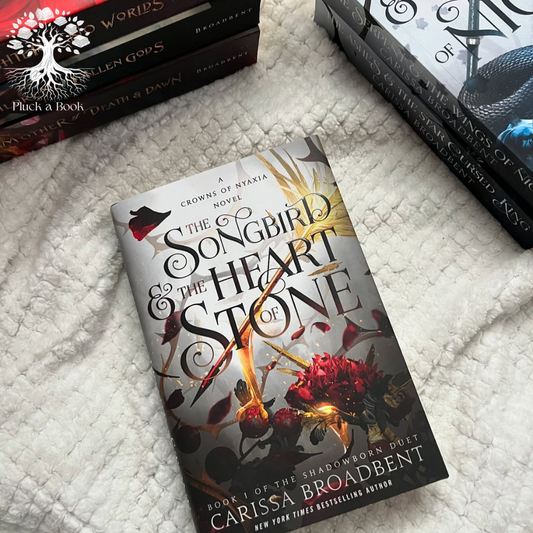 THE SONGBIRD AND THE HEART OF STONE: Crowns Of Nyaxia Series (Book 3) by Carissa Broadbent